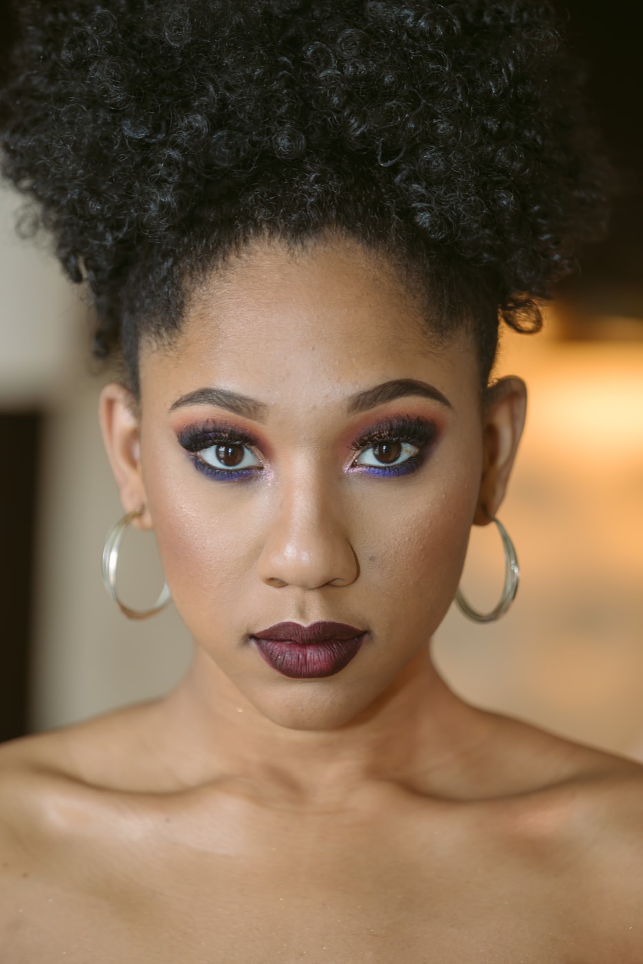 Close editorial headshot, polished makeup. Photograph by Samuel Mfinanga for Mfinanga Photography + Motion.