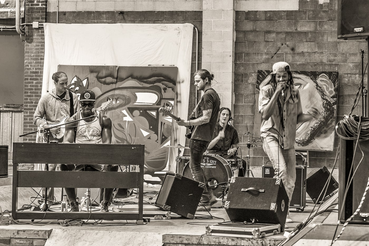 Live band performance photograph with documentary motion feel. Photograph by Samuel Mfinanga for Mfinanga Photography + Motion.