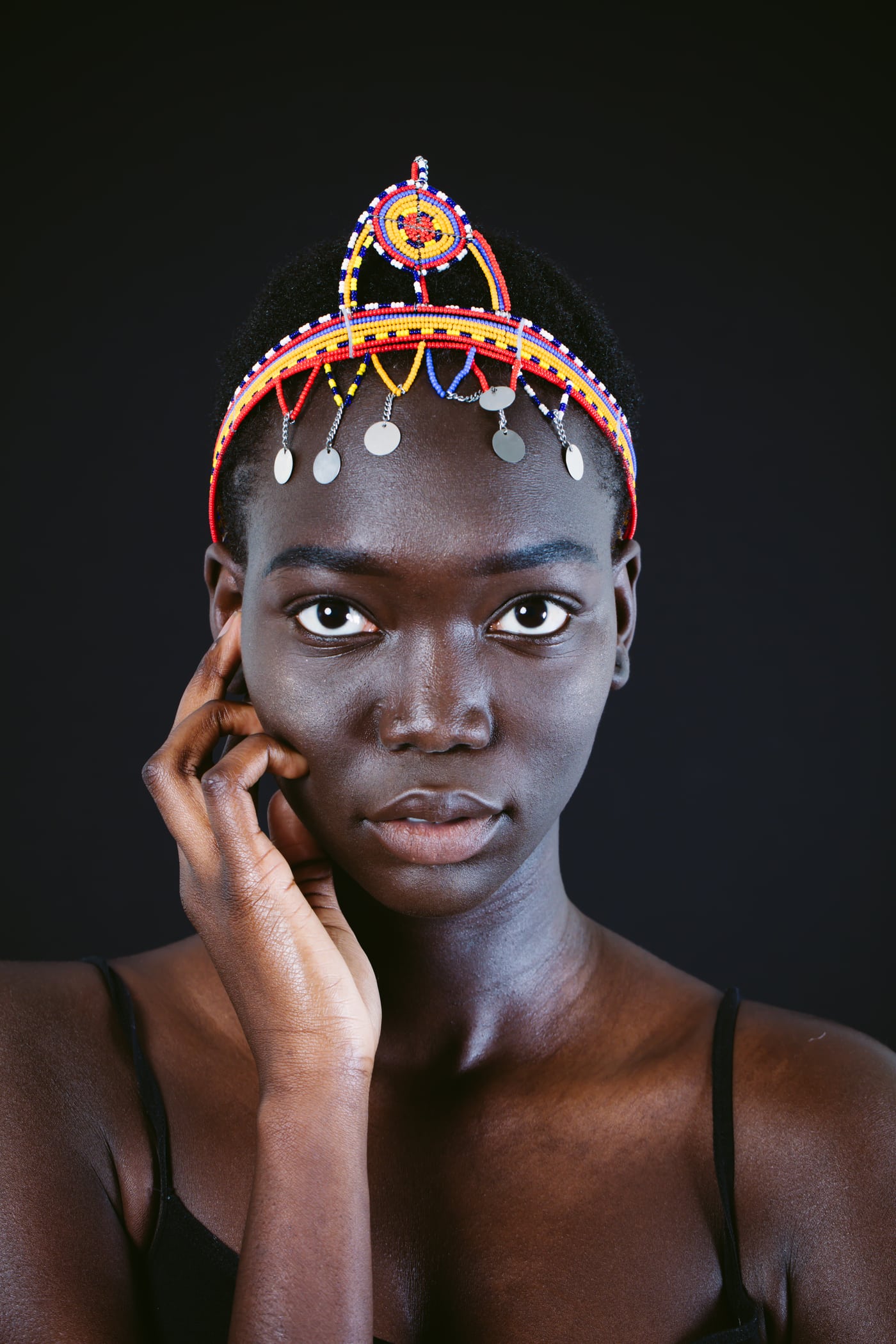 Model beaded crown, black top, elite beauty. Photograph by Samuel Mfinanga for Mfinanga Photography + Motion.