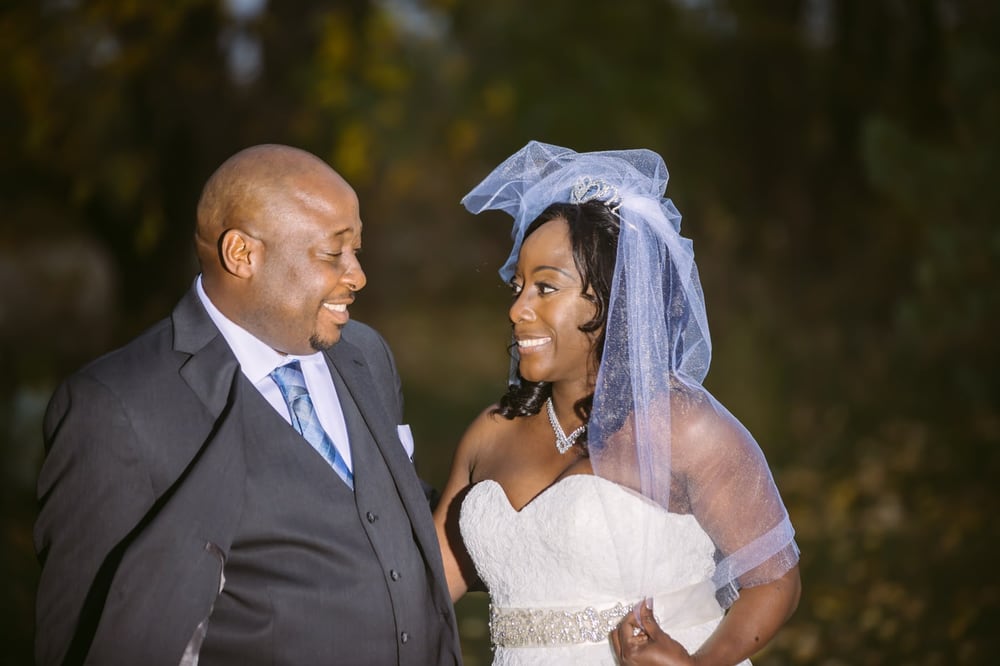 Wedding couple portrait with warm evening light and clear emotion.